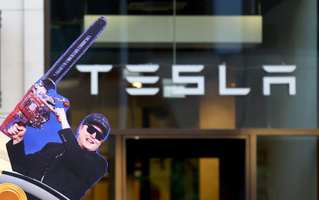 Activists of the "New Generation" (Neue Generation) and Extinction Rebellion protest in front of a Tesla store in Berlin