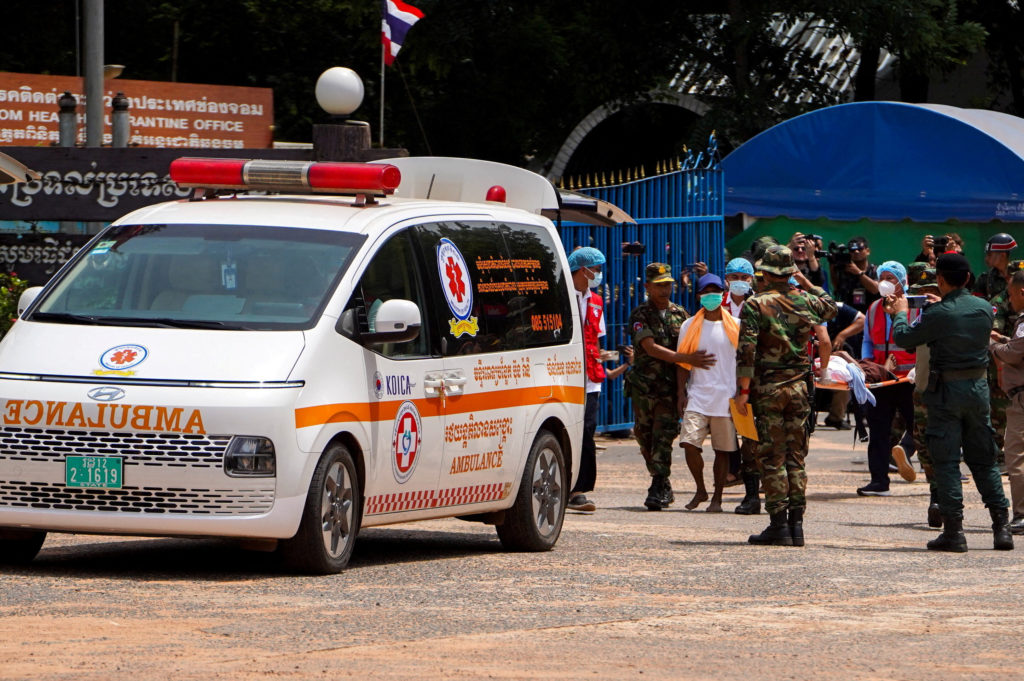 Two Cambodian soldiers (white shirts) who were detained in Thailand, are released from captivity, at O Smach town located ...