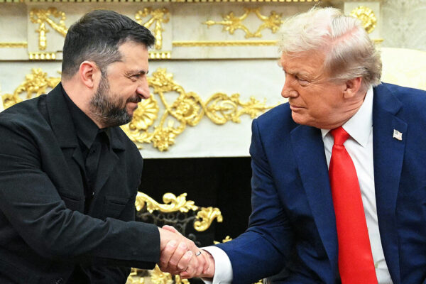 Ukrainian President Volodymyr Zelensky and US President Donald Trump shake hands during a meeting in the Oval Office of the White House in Washington, DC, on August 18, 2025