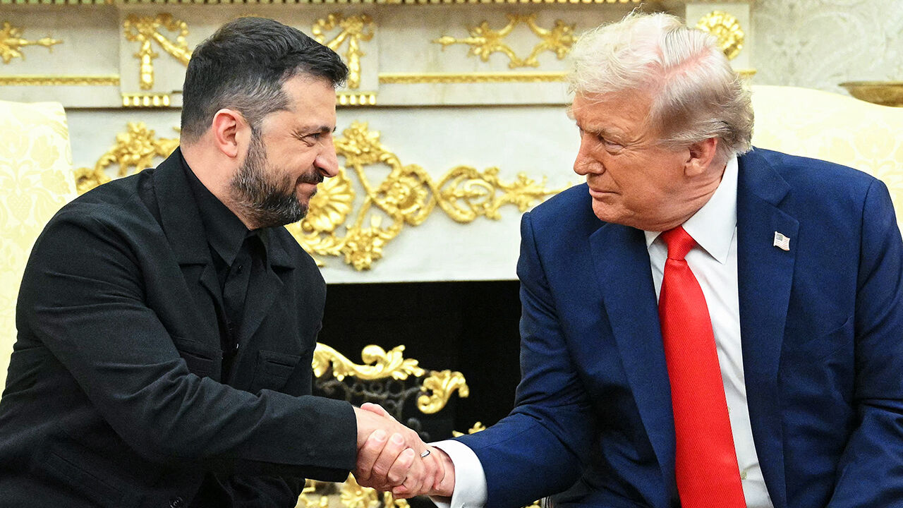 Ukrainian President Volodymyr Zelensky and US President Donald Trump shake hands during a meeting in the Oval Office of the White House in Washington, DC, on August 18, 2025