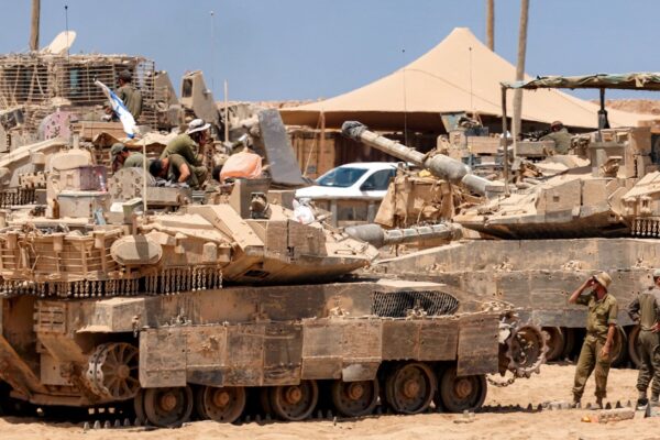 Satellite images show Israel building up forces for a possible ground invasion of Gaza, sources say