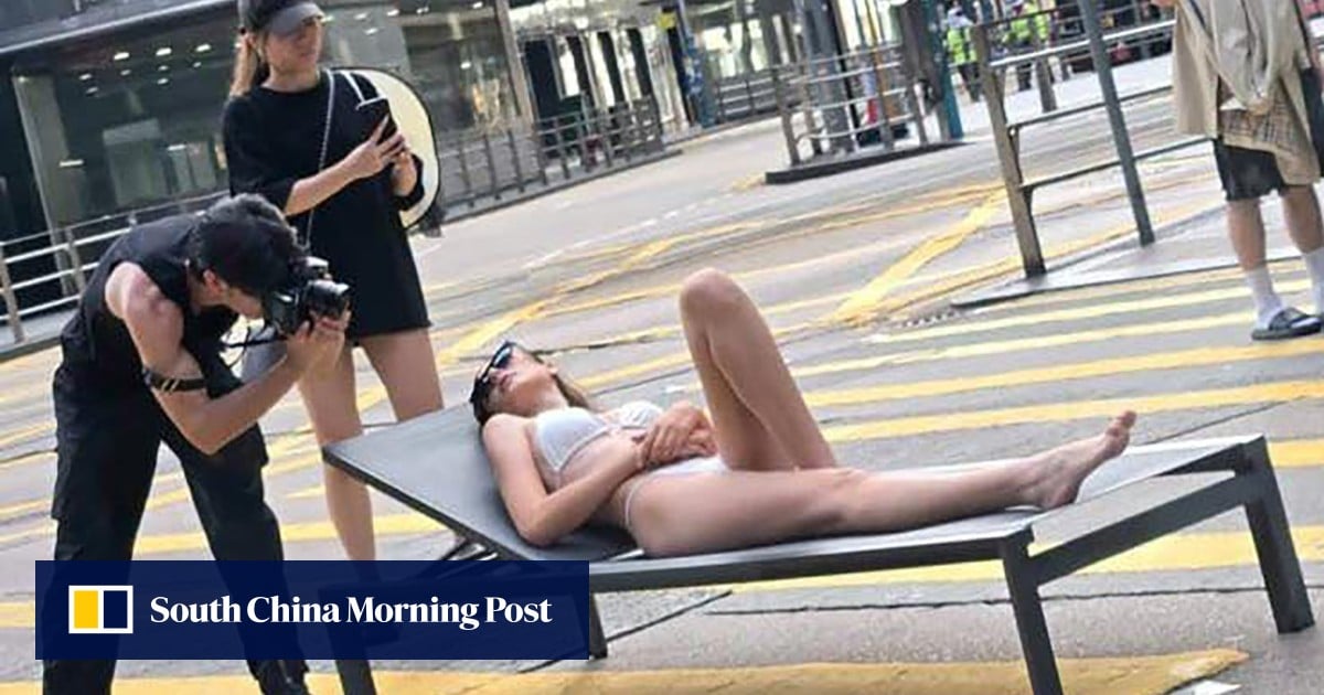 Woman in bikini on central Hong Kong road crossing gets pulses racing on buses
