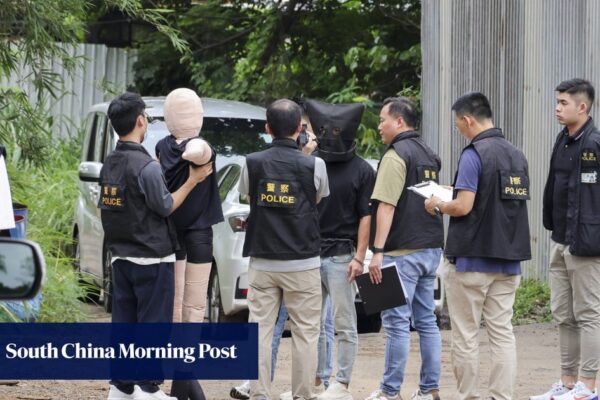 Suspect in Hong Kong illicit cigarette murder case taken to crime scene Suspect in Hong Kong illicit cigarette murder case taken to crime scene