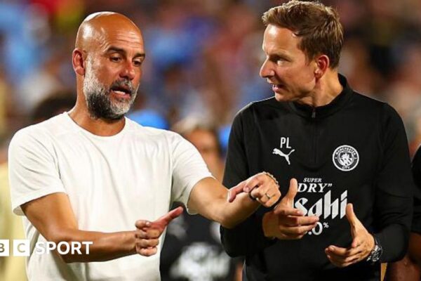 Pep Guardiola and Pep Lijnders talk to each other