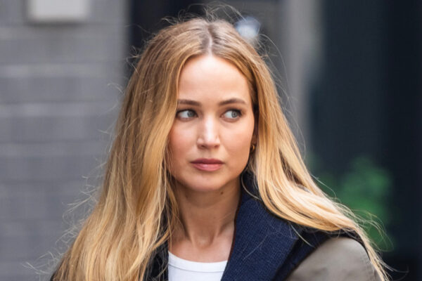 Jennifer Lawrence has long blonde hair and wears Ugg slippers and carries a Liffner basket bag