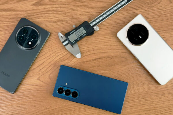Oppo Find N5, Samsung Galaxy Z Fold 7 and Honor Magic V5 on a table with some digital calipers