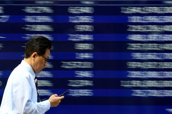 Japan's Topix hits record high on Wall Street rally, solid earnings