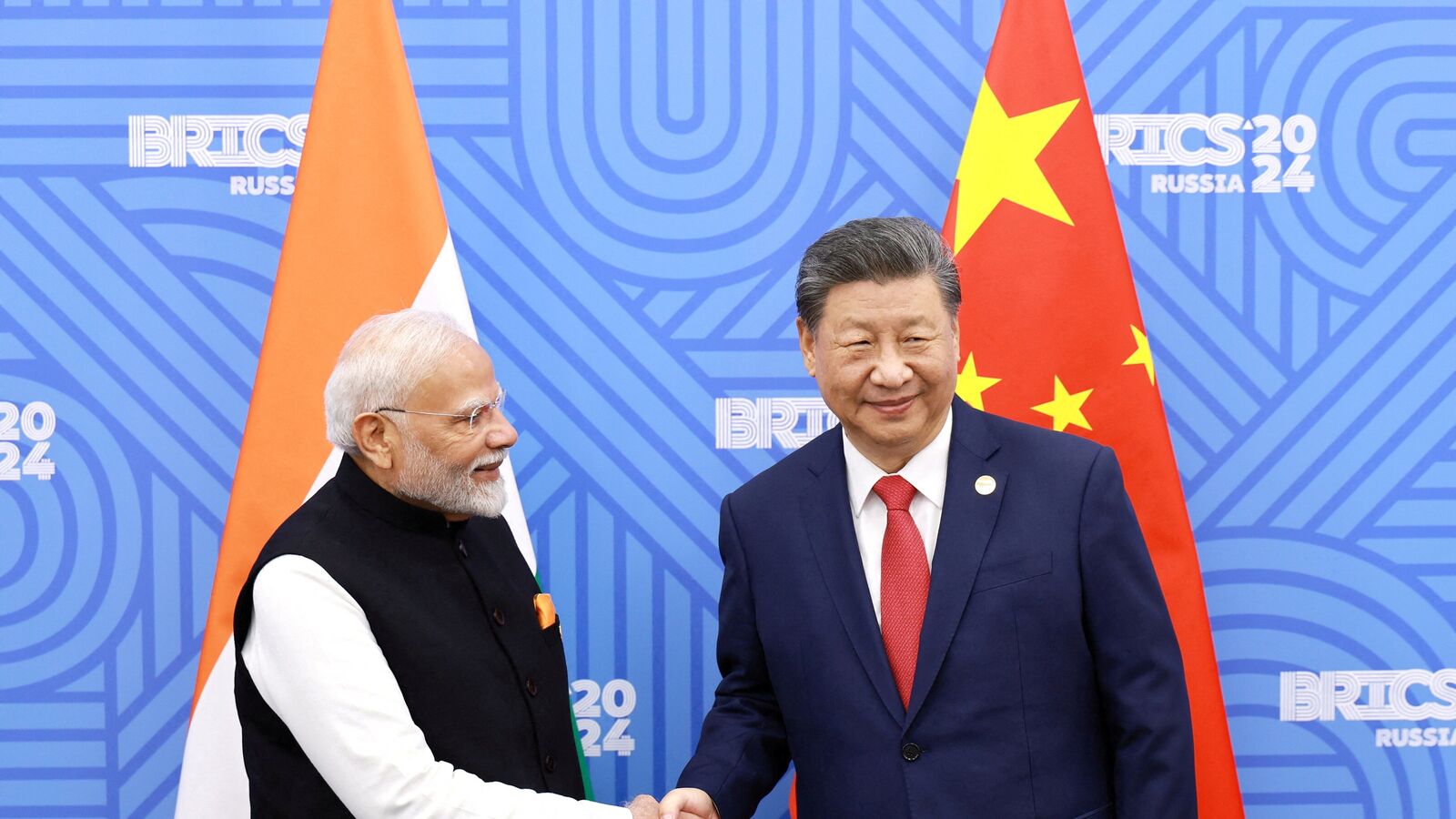 Chinese President Xi Jinping and India Prime Minister Narendra Modi meet on the sidelines of the BRICS summit in Kazan, Russia October 23, 2024. China Daily via REUTERS  ATTENTION EDITORS -