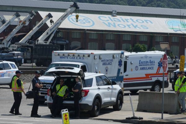 Emergency crew gather after an explosion at the Clairton Coke Works, a U.S. Steel coking plant, Monday, Aug 11, 2025, in Clairton, Penn. (AP Photo/Gene Puskar)