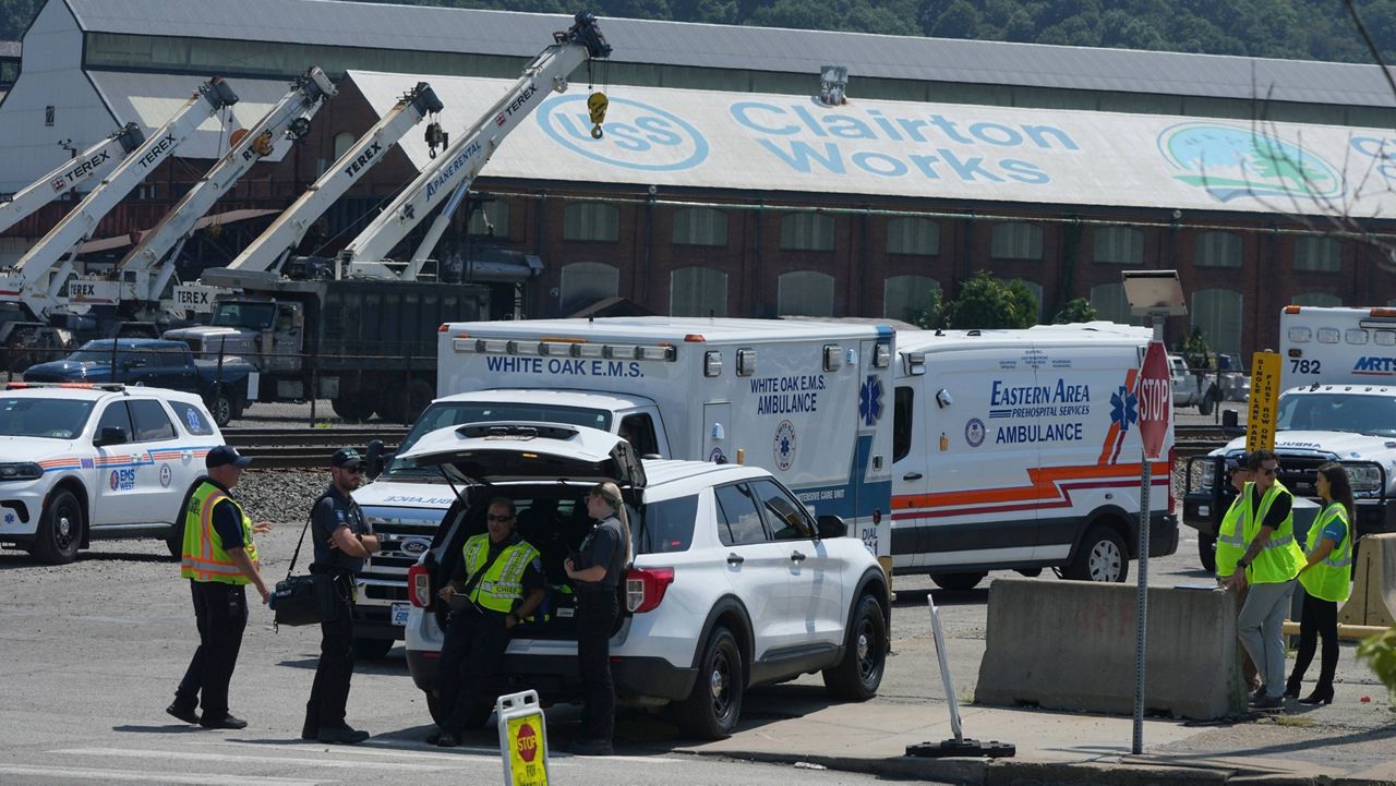 Emergency crew gather after an explosion at the Clairton Coke Works, a U.S. Steel coking plant, Monday, Aug 11, 2025, in Clairton, Penn. (AP Photo/Gene Puskar)