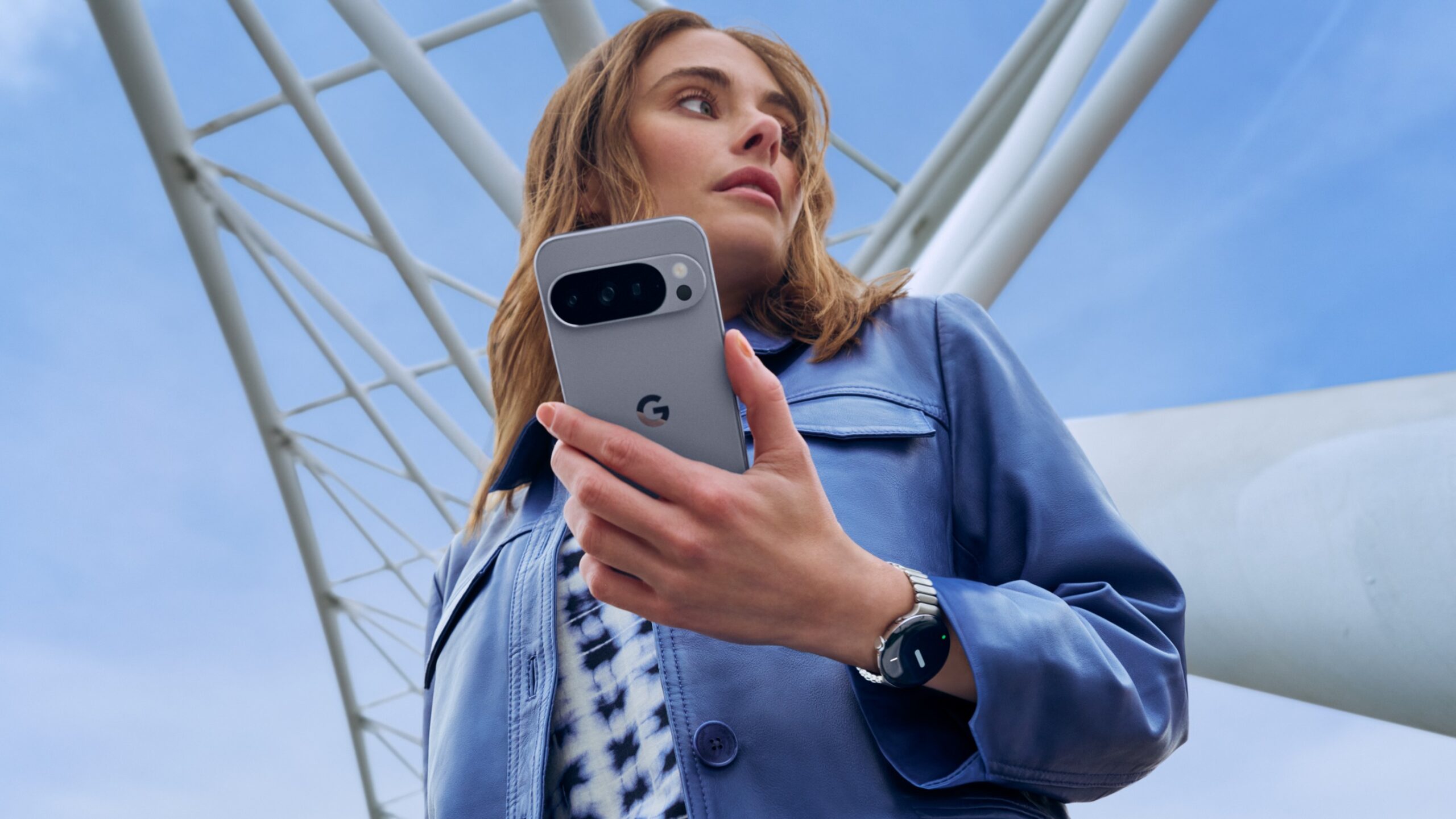 A woman holding the Google Pixel 10 Pro
