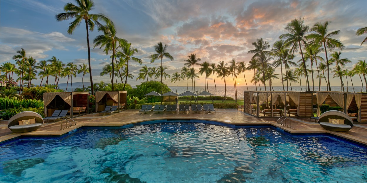 Grand Wailea, A Waldorf Astoria Resort Hibiscus Serenity Pool, pool, palm trees, cabanas, ocean view, pool daybeds, chaise lounge pool chairs with umbrellas