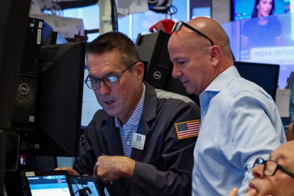 Dow briefly hits record high on UnitedHealth's gains; data in focus