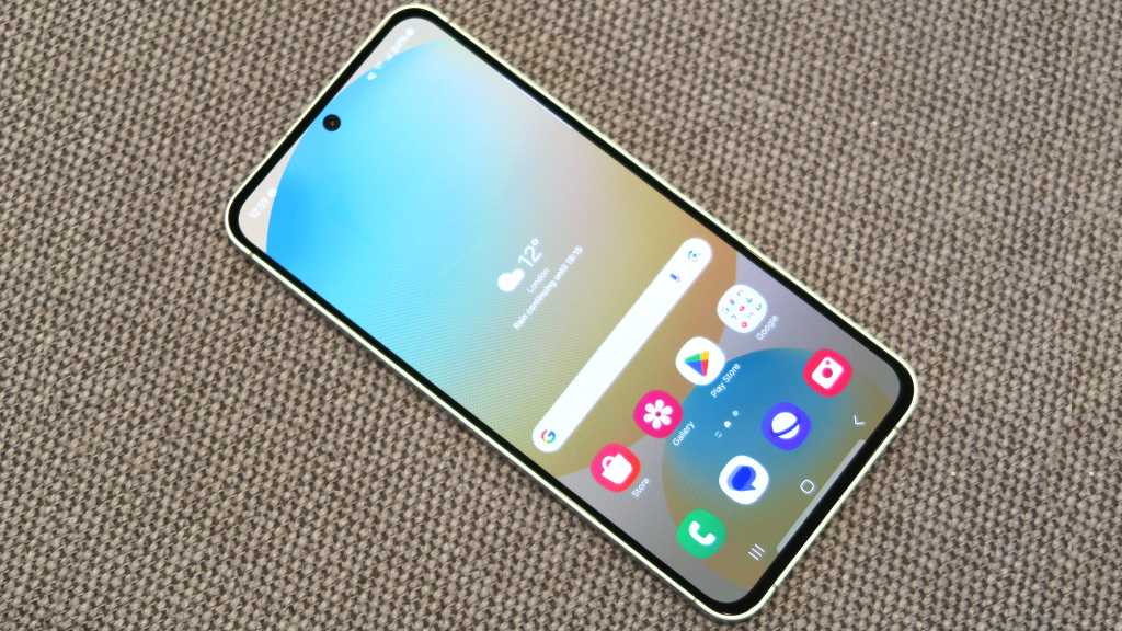 Samsung Galaxy S24 FE hands on front angled