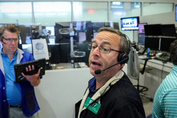 Dow notches record high as Wall Street cheers Powell's speech