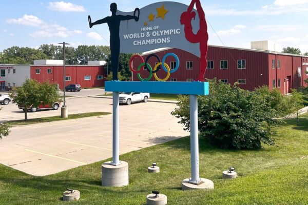 Former coach at prominent U.S. gymnastics academy arrested by FBI years after reports of abuse