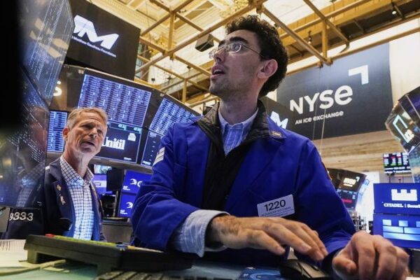 Dow soars more than 800 points into record territory as Powell hints at rate cut