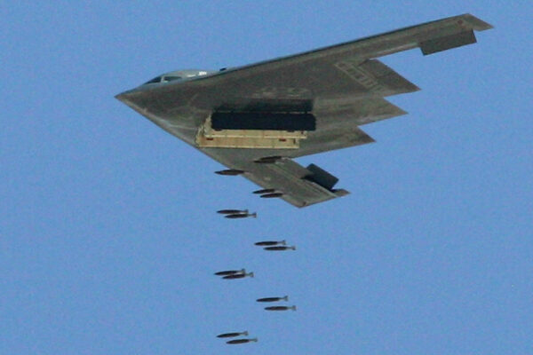A B-2 bomber left a smiley face made out of bomb craters on the 'runway' of a mock airfield during a test some two decades ago.