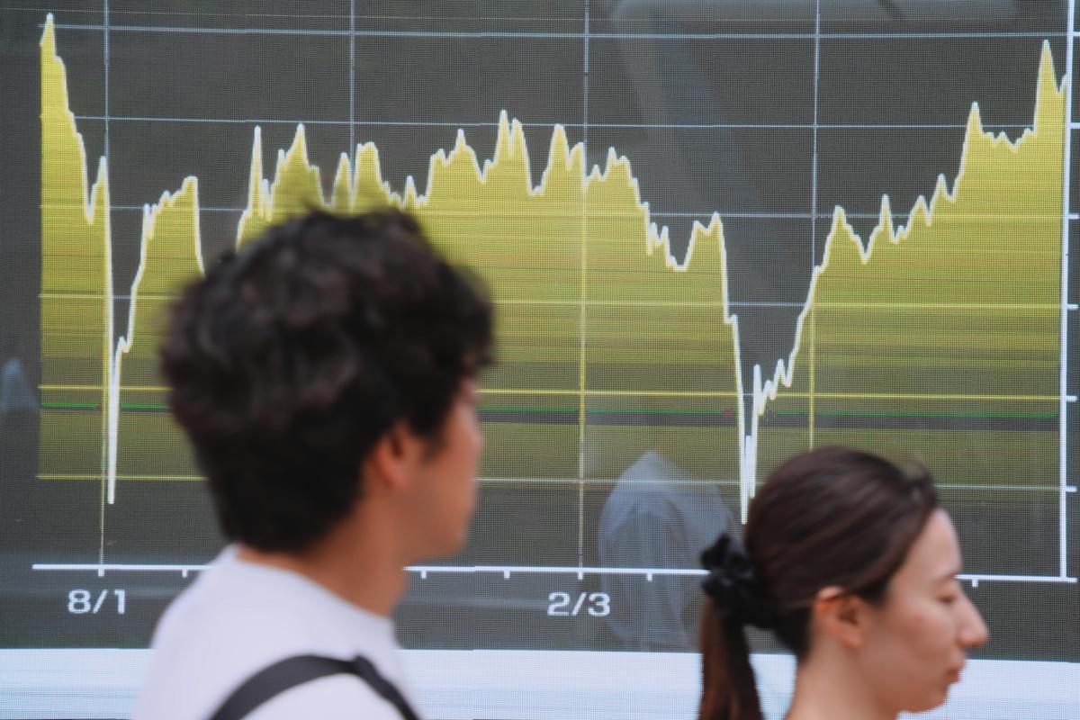 Asian shares are mixed after Wall Street fell to its 5th straight loss