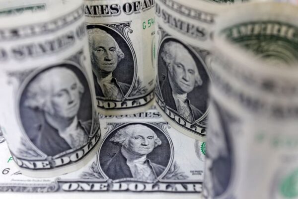 Dollar bides time as markets brace for Ukraine summit