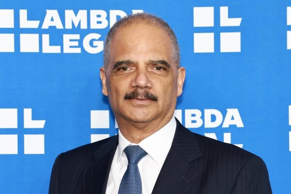 Former Attorney General Eric Holder talks with House Democrats about redistricting