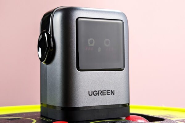 UGreen Uno Charger 100W plugged in with blushing emoji on display