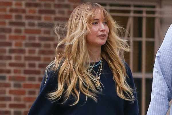 Jennifer Lawrence styled a navy sweater with her favorite skirt-pants and a Dior bowling bag