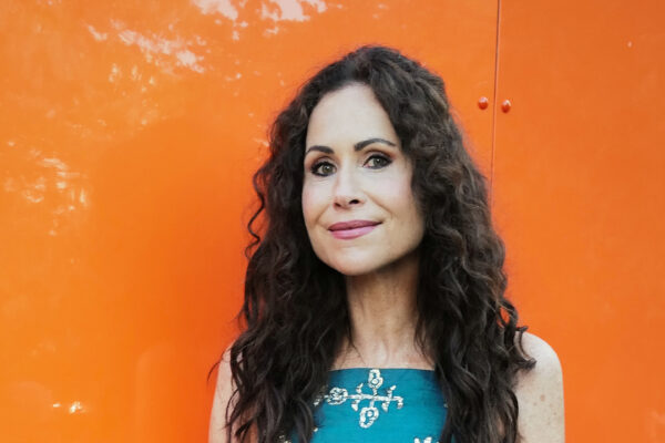 Minnie Driver wearing a blue dress