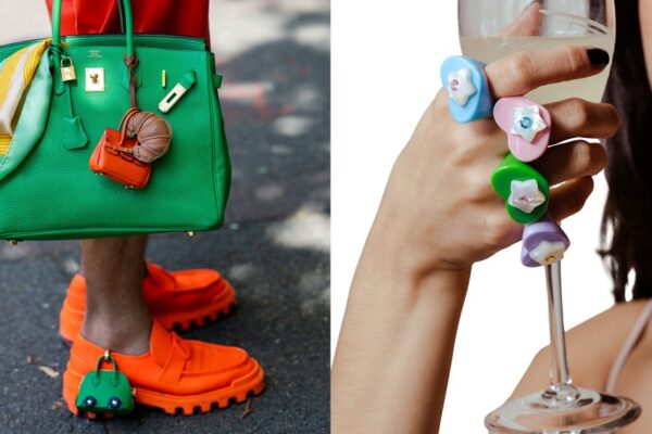 a street style image of an hermes bag with bag charms and playful puffy heart rings