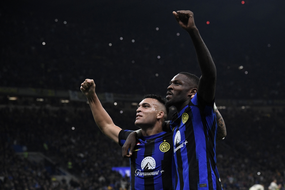 TOPSHOT - Inter Milan forward Marcus Thuram (R) celebrates with teammate Inter Milan forward Lautaro Martinez after scoring the team