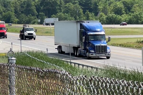 U.S. halts issuing work visas for commercial truck drivers A truck drives down the road. (Spectrum News 1 Photo)