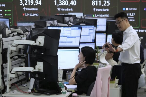 World shares are mixed as Tokyo's benchmark jumps on tariff news