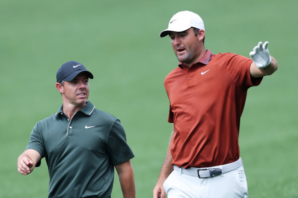 Rory McIlroy (left) and Scottie Scheffler chat during round one of the 2025 PGA Championship