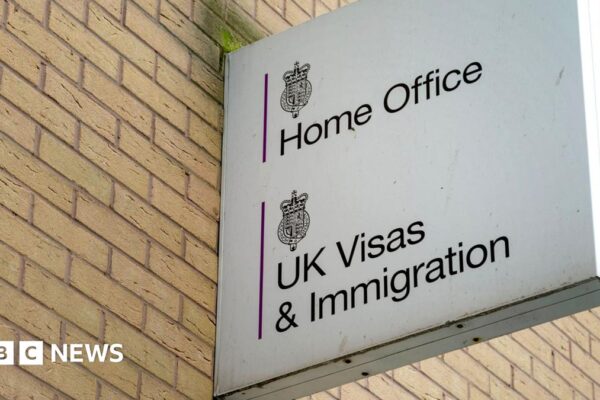 A sign reading "Home Office, UK Visas and Immigration"