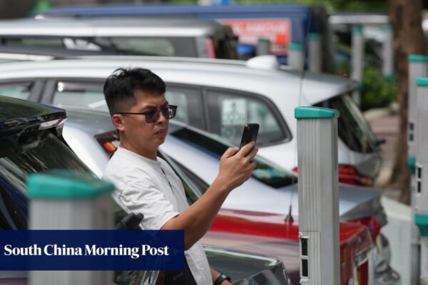 Taxi drivers grumble as Hong Kong doubles parking meter charge