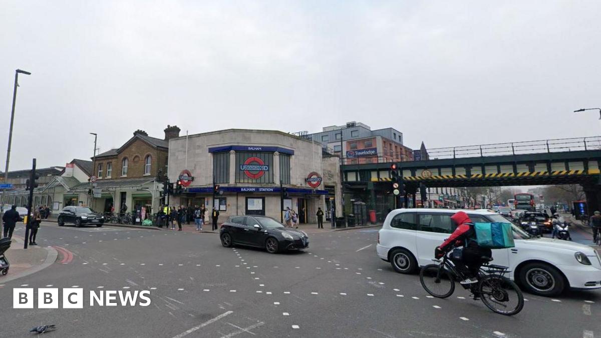 A general view of Balham High Road, showing Balham Underground station and a busy crossroads.