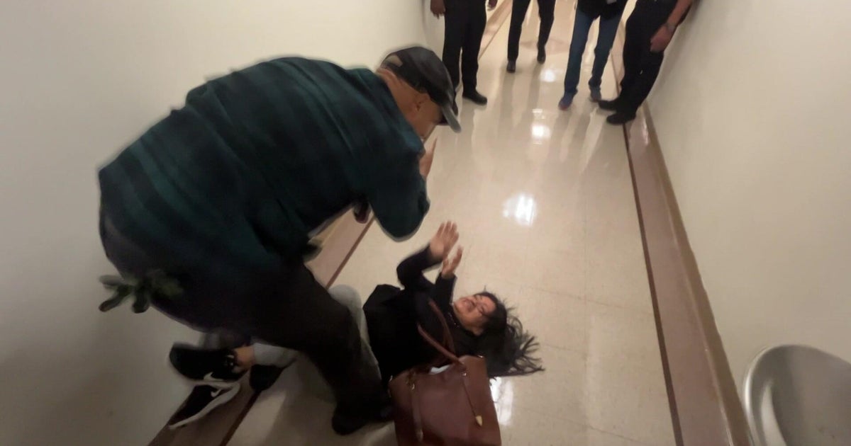 "Unacceptable": ICE officer relieved of duties after videos show him shoving woman to the ground