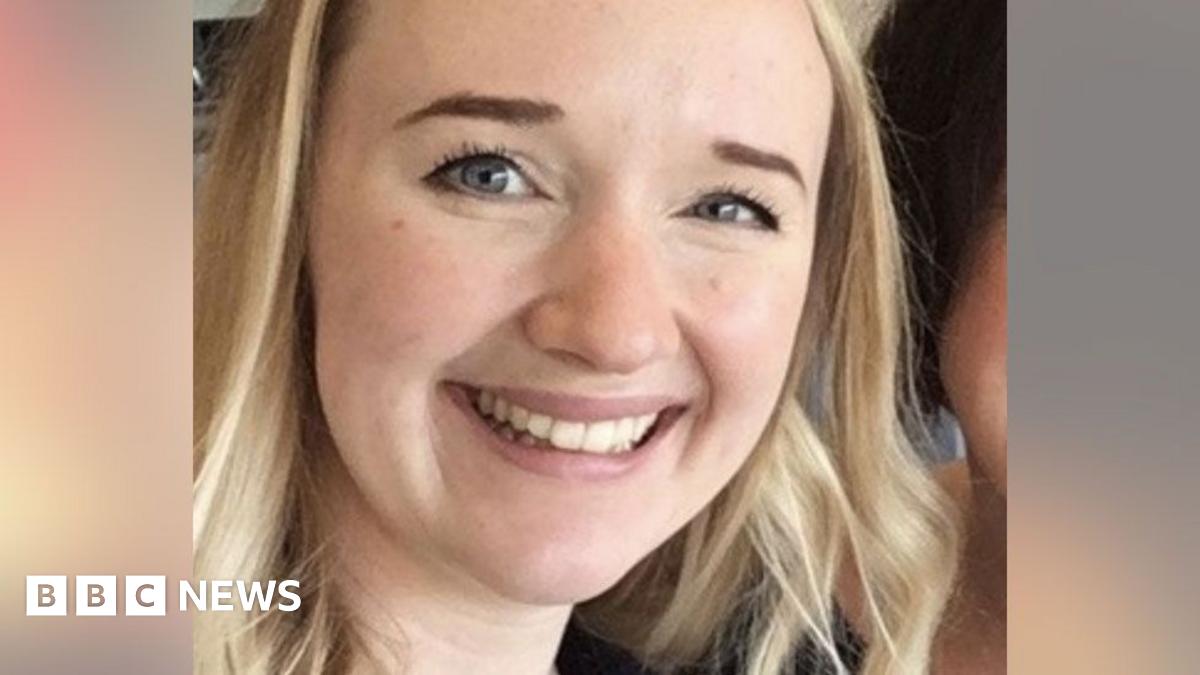 A close-up photo of Jessica Brady who is smiling broadly and looking directly at the camera, with long blonde hair, brown eyes and a visible earing in her left ear.