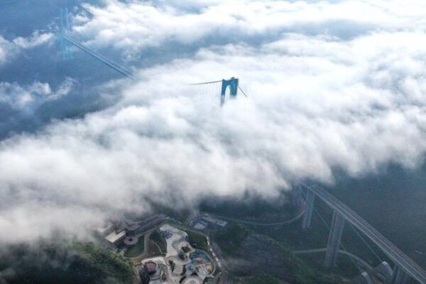 China Opens World’s Tallest Bridge to Traffic...