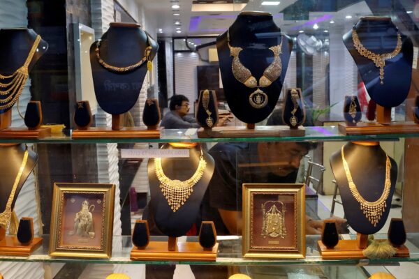 Gold hits record high, heads for best month in 14 years on safe-haven rush