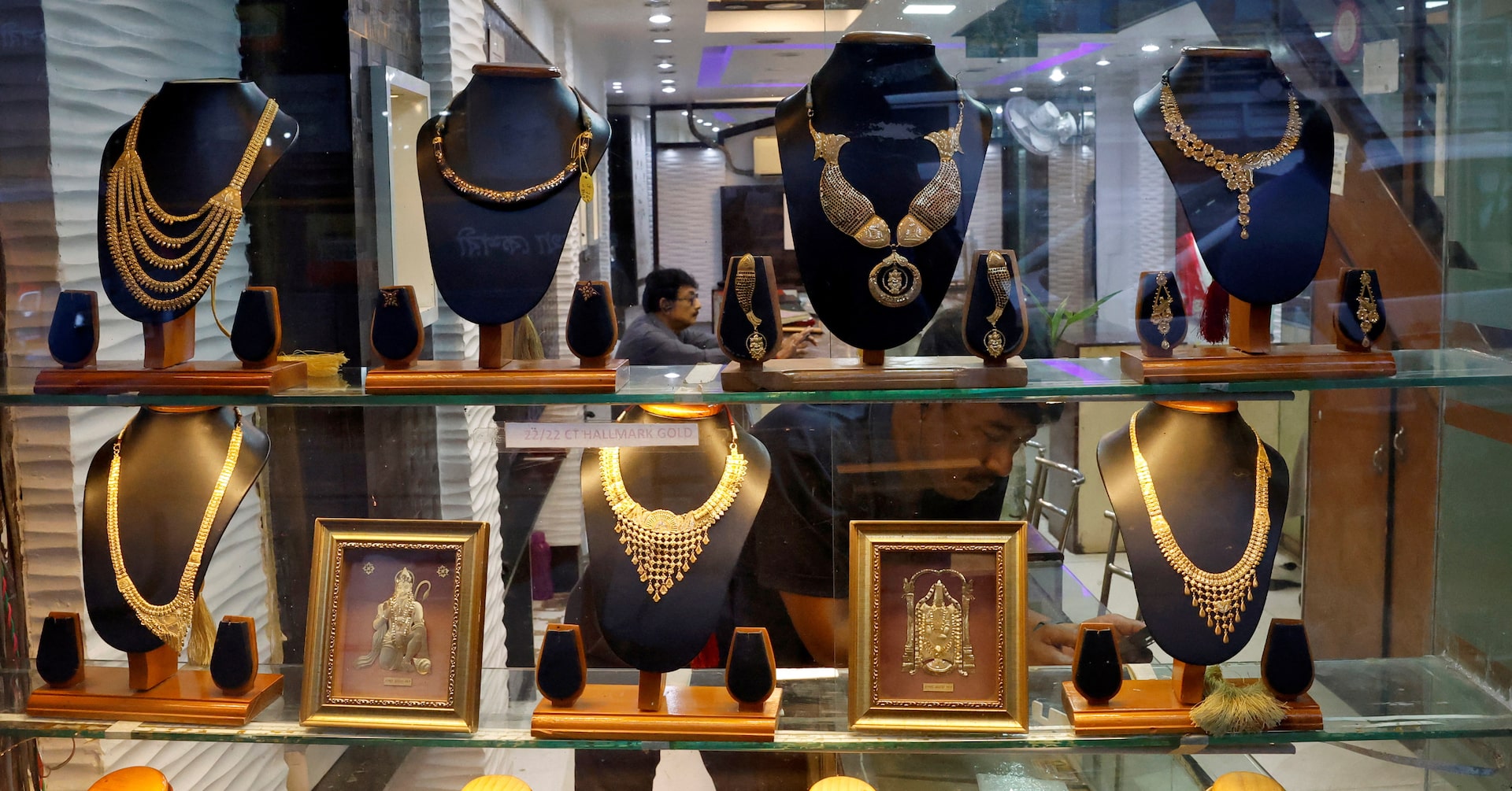 Gold hits record high, heads for best month in 14 years on safe-haven rush