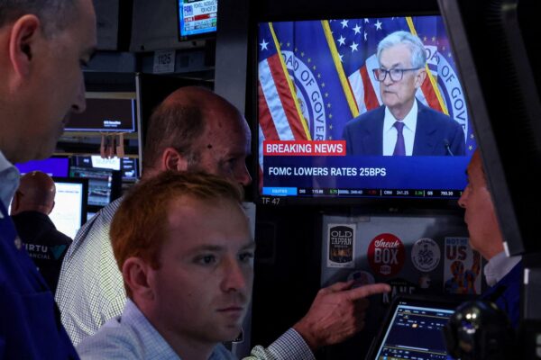 Fed's rate cut comes with caveats, leaving investors lukewarm