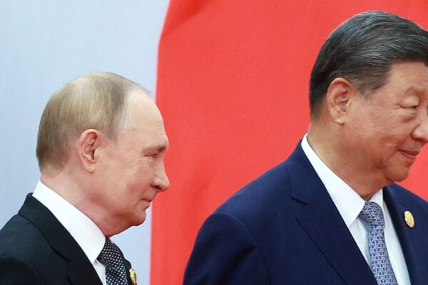 China's Xi pushes a new global order, flanked by leaders of Russia and India