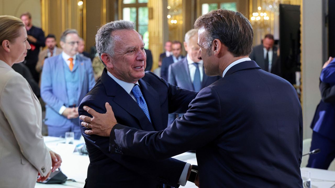 White House Special Envoy Steve Witkoff, left, shakes hand with France's President Emmanuel Macron during a summit on Ukraine at the Elysee Palace, in Paris, France, Thursday, Sept. 4, 2025. (Ludovic Marin/Pool Photo via AP)