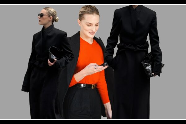 Christie Tyler wearing a red sweater and an all-black jacket in New York