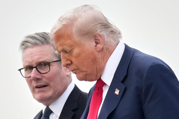 President Donald Trump and Britain's Prime Minister Keir Starmer exit Air Force One as they arrive at Royal Air Force Lossiemouth en route to Aberdeen, Scotland, on July 28.