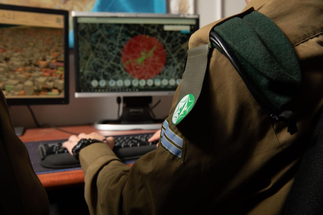 A soldier from the Israeli armys Military Intelligence Directorate works at a computer at an undated time and location. (Photo via Israeli army)