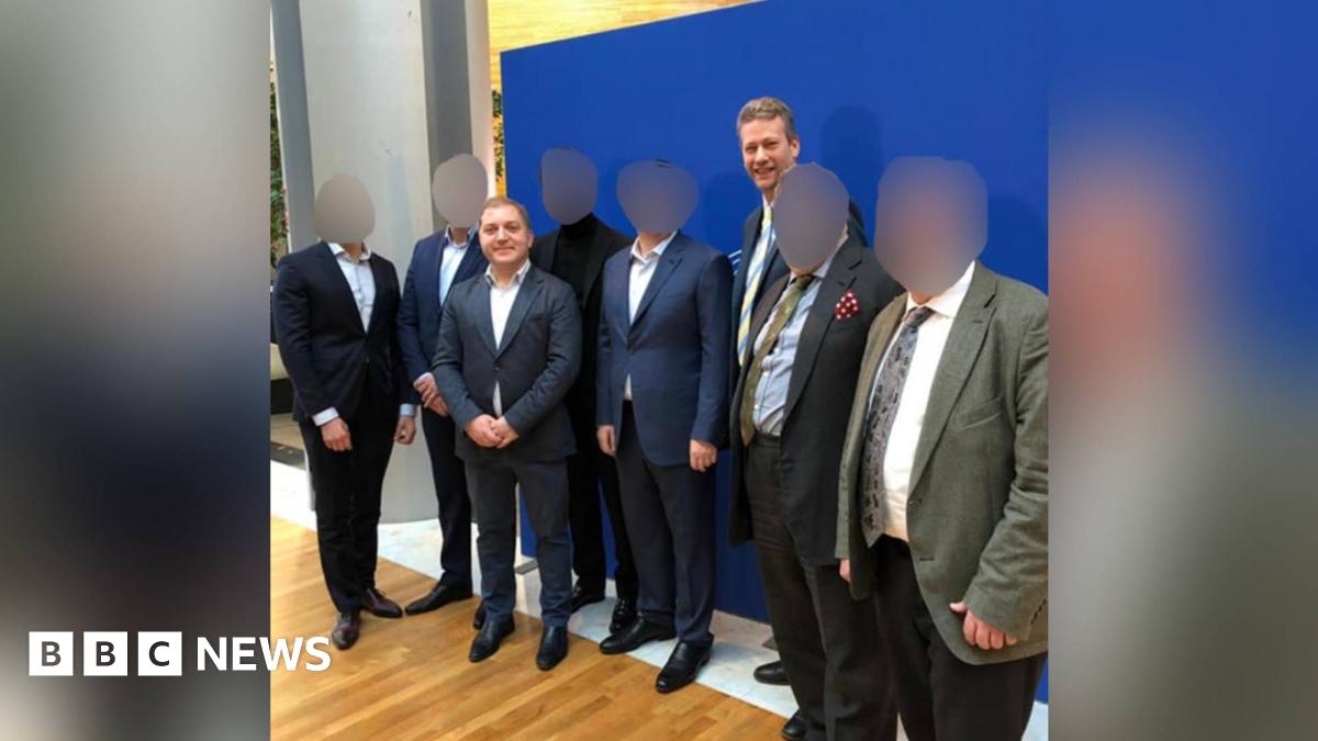 Published on the website of a Ukrainian tv channel (112ua.tv) in February 2019 - the channel has been shut down by Zelensky after the Russian invasion. Third from left is Oleg Voloshyn, named in David Deans' copy and was the man in contact with Nathan Gill before his speeches in the European Parliament. Gill and Voloshyn both wear suits and stand among six other men in suits.