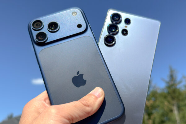 iPhone 17 Pro Max and Galaxy S25 Ultra held in the hand.