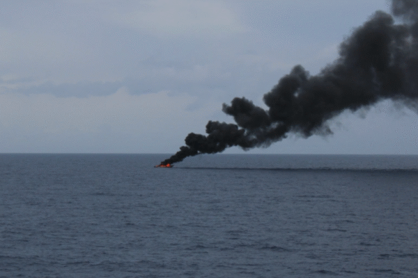 Coast Guard seizes over $220 million worth of cocaine, releases image of alleged drug boat on fire
